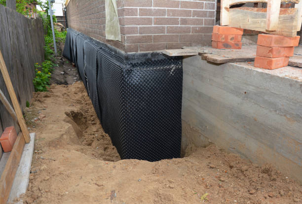 Happy homeowners after waterproofing job in DuPont